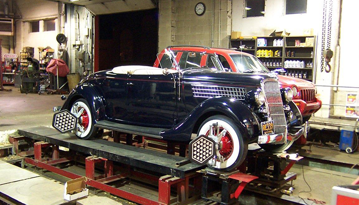Classic convertible is shown having an alignment completed at Dias Spring Service Automotive Center.