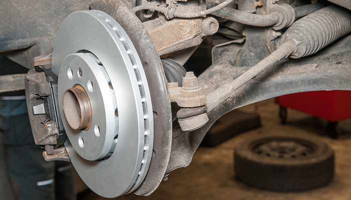 Shown:  Brakes being replaced on a car at Dias Spring Service in Erie, PA.